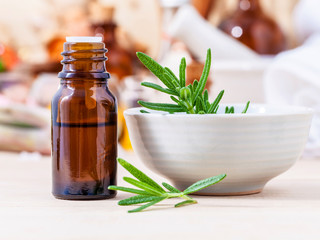 Fresh rosemary and essential oil with shallow depth of field set