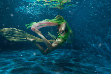 Fototapeta na wymiar Girl with a cloth in the water.