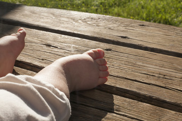 Chubby bare baby feet