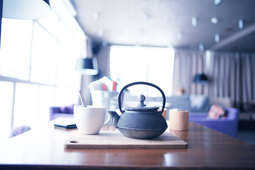 teapot and cup of tea at a cafe
