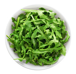 Bowl with fresh green salad arugula isolated on white background