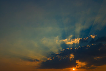 Beautiful sky with clouds and sun rays at sunset