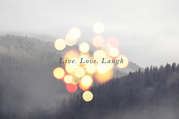 Live laugh love- inspirational message on mountain landscape