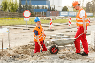 Worker with wheelbarrow