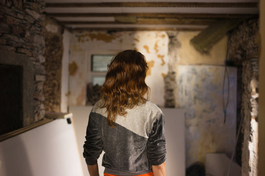 Young woman in derelict room