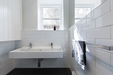 Double basin vanity in modern white renovated bathroom horizonta
