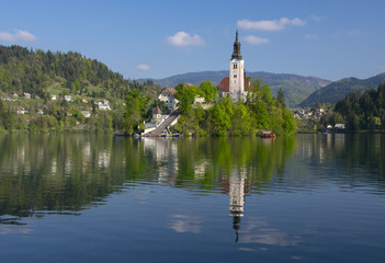 Bled lake and pilgrimage church with mountain landscape background