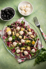 mixed salad with pineapple  mozzarella arugula and chicory