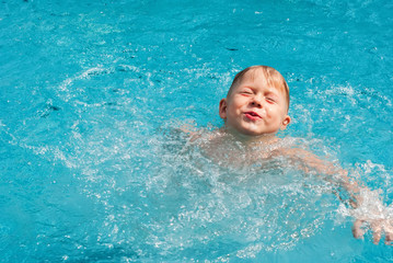 Fototapeta na wymiar Caucasian Child Boy Swimming Pool