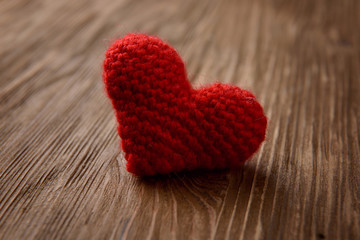 red heart on wooden background