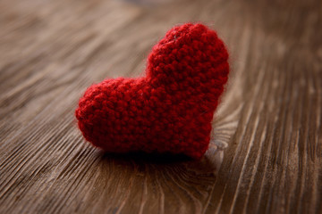 red heart on wooden background