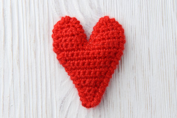 red heart on white wooden background