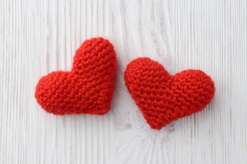 red hearts on white wooden background