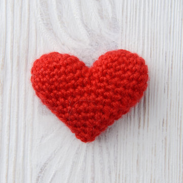 red heart on white wooden background