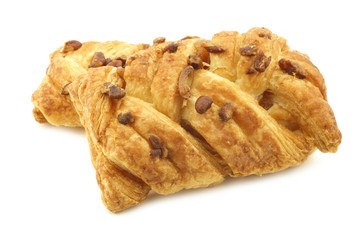 freshly baked pecan buns with apricot filling on a white background