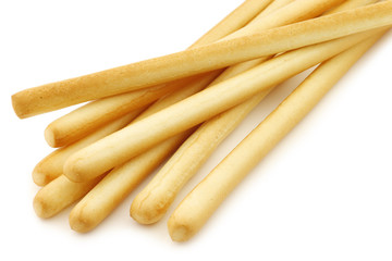 bunch of bread sticks on a white background