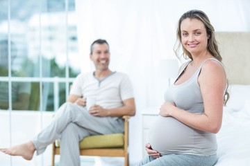 Obraz premium Pregnant woman touching her belly