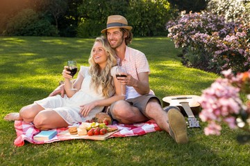 Happy couple having a picnic and embracing