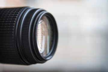 Fototapeta na wymiar Close-up of a digital camera lens. Large copyspace.