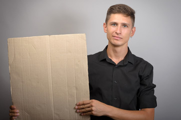 man holding a blank board