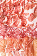 Antipasti composition of italian cured meat types. 