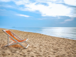 Fototapeta na wymiar beach chair on tropical white sand