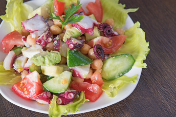 Delicious salad with Octopus and vegetables