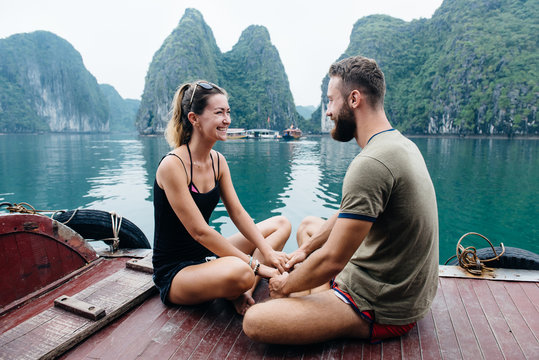 Couple travel on cruise ship, view on Ha long Bay