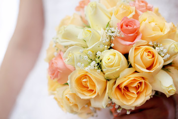 Bride with wedding rose bouquet