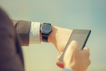 Urban guy using cellphone outdoors.