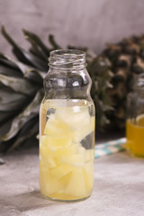 Pineapple drink in small glass bottle