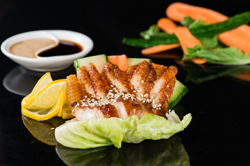 eel sashimi with carrots and cucumber