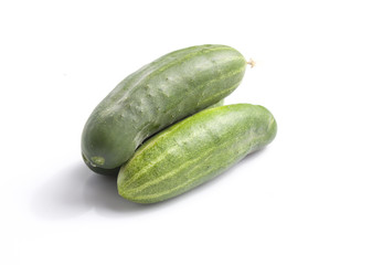 Green cucumber on white