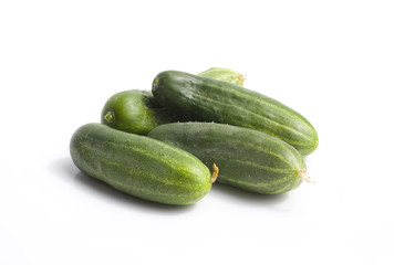 Green cucumber on white