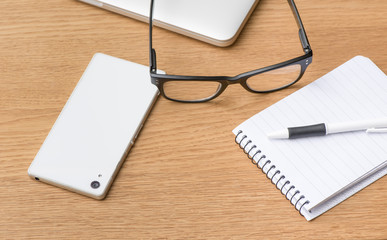 Office desktop with notebook and pen