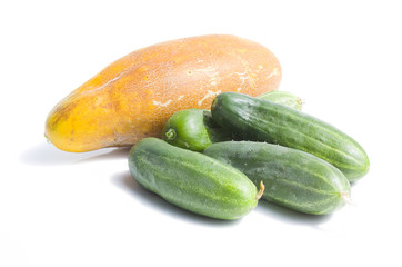Green and yellow  cucumber on white
