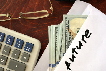 Future written on an envelope with dollars. Savings concept.