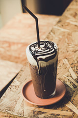Iced chocolate shake on wood