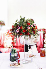 White table set for dinner with empty wineglasses