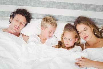 High angle view of family sleeping