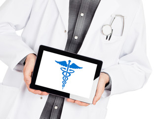 Doctor holding tablet - Caduceus symbol