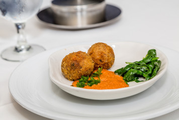 Conch Fritters and Wilted Spinach