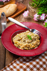 Fried cabbage greens and onion in wooden table.