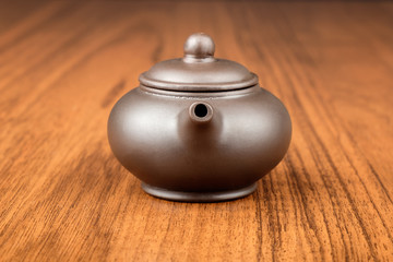 Chinese teapot on woden desk