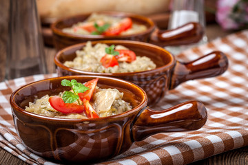Fried cabbage greens and onion in wooden table.
