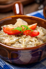 Fried cabbage greens and onion in wooden table.