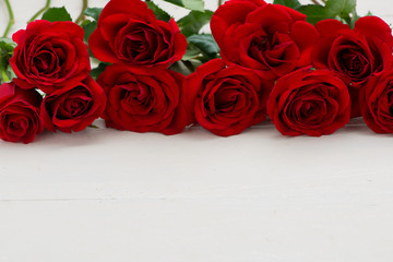 red roses on white wood