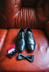 Set of groom clothes. Wedding rings, shoes, cufflinks and bow tie detalis
