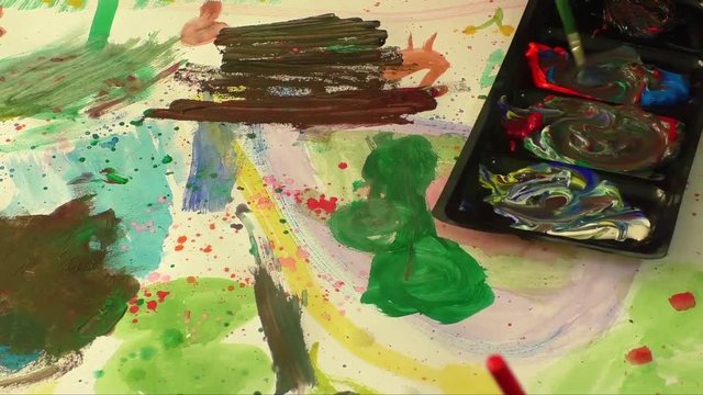 Children little artist painting hand brush colorful watercolor art 
