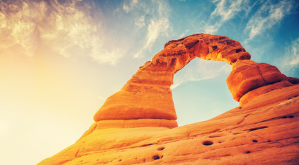 Vintage toned Delicate Arch at sunset, Arches National Park in Utah, USA.